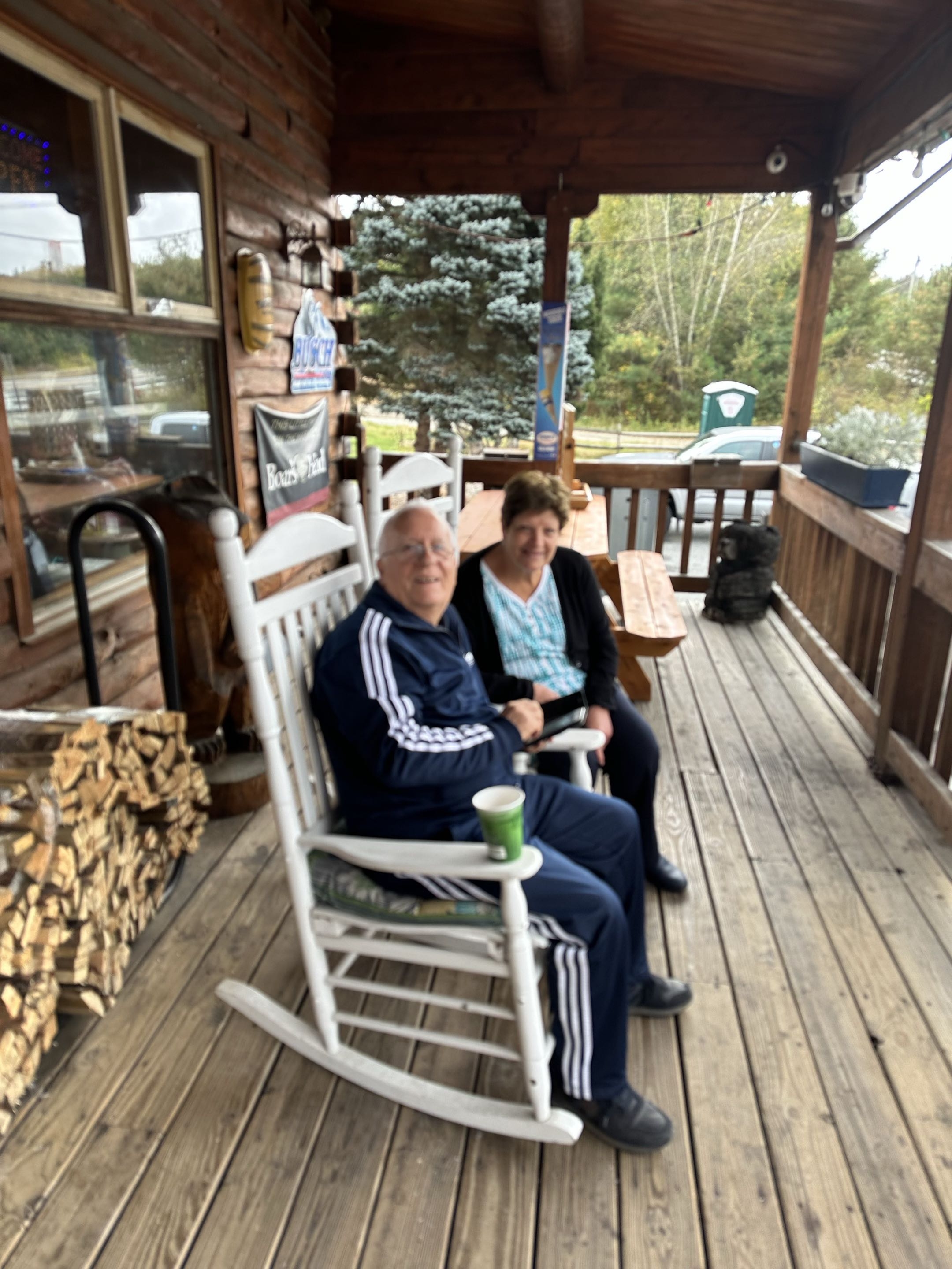 Customers enjoying coffee on the front porch